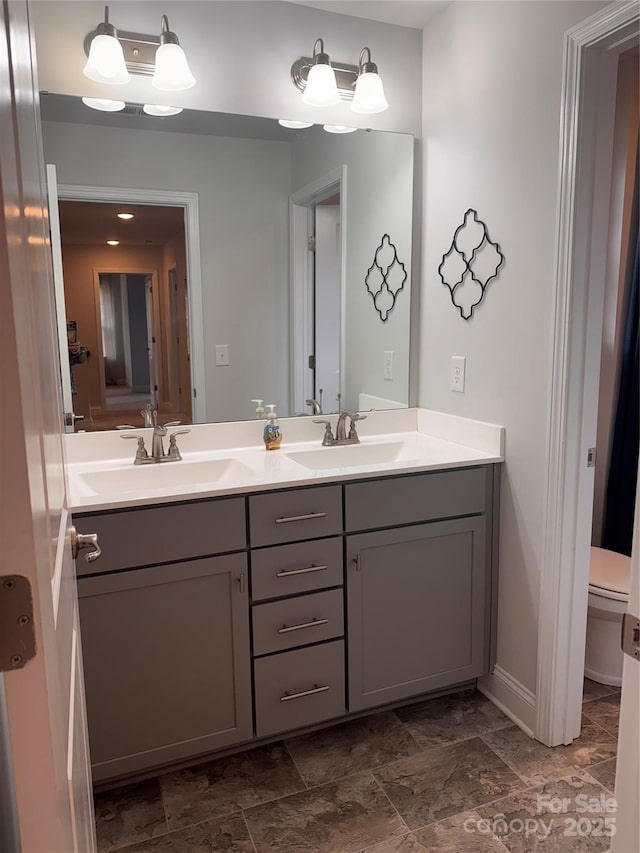 704 Robert Moses Dr Unit 121, Gastonia, NC 28056 - full bath featuring a sink, baseboards, toilet, and double vanity