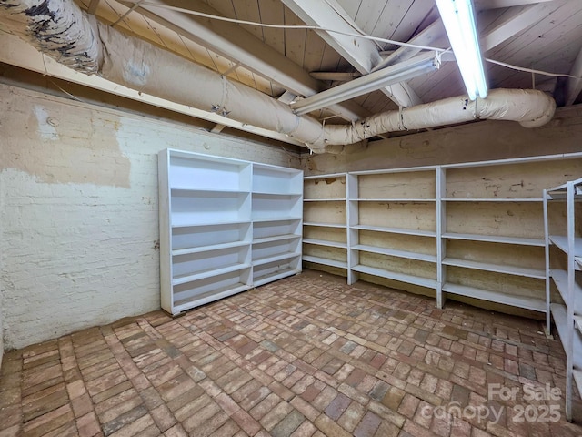 unfinished below grade area with brick flooring
