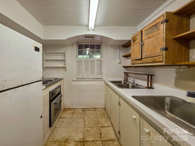 kitchen featuring open shelves, oven, a sink, light countertops, and wooden ceiling