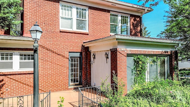 view of front of home featuring brick siding