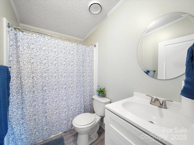 full bath with a textured ceiling, wood finished floors, ornamental molding, toilet, and vanity