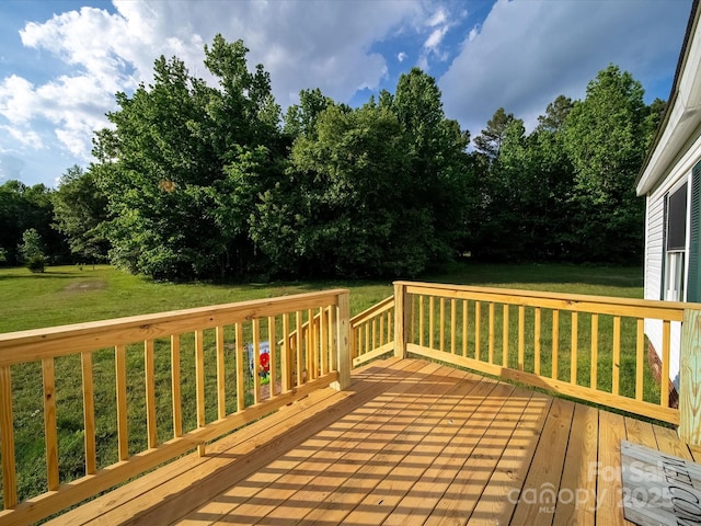 deck featuring a yard