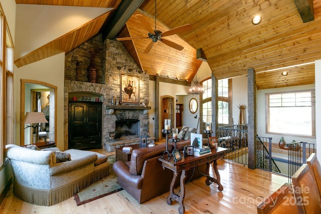 living room with wood ceiling, wood finished floors, beam ceiling, and ceiling fan