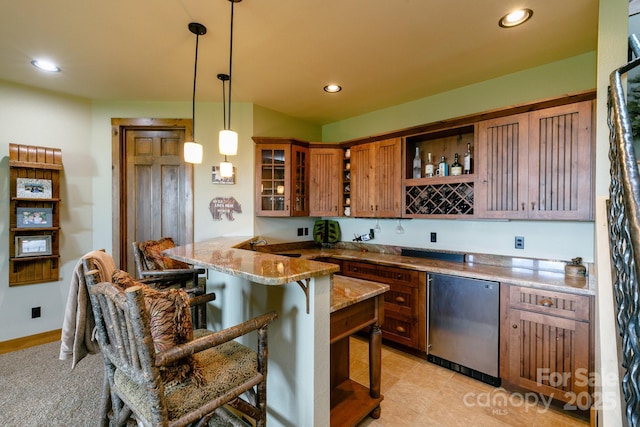 bar with decorative light fixtures, refrigerator, wet bar, and recessed lighting