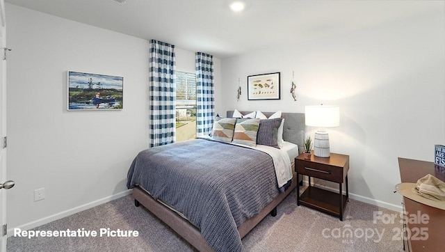 bedroom with carpet and baseboards