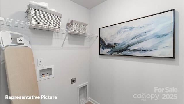 laundry room with hookup for an electric dryer, hookup for a washing machine, and baseboards