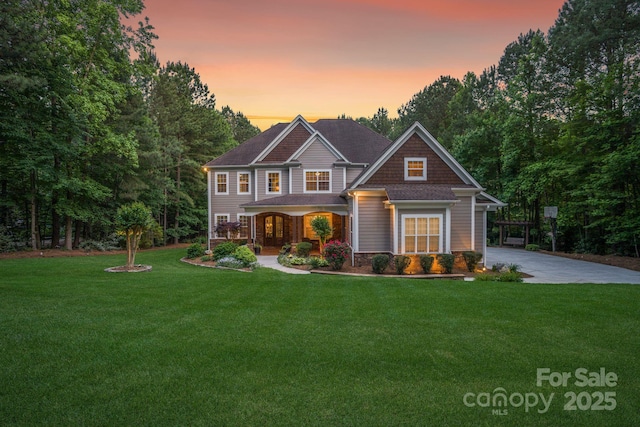 craftsman inspired home featuring a lawn