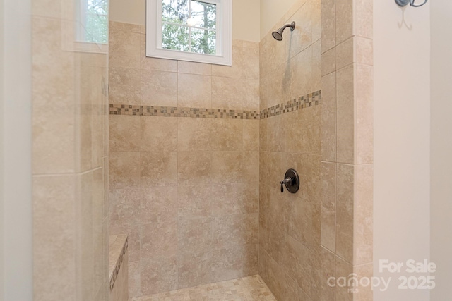 bathroom with a tile shower