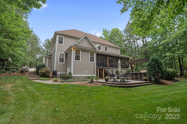 rear view of property featuring a sunroom, a patio area, a yard, a pergola, and stairs