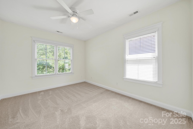 1855 Second Baxter Xing, Fort Mill, SC 29708 - spare room featuring baseboards, light carpet, and a ceiling fan