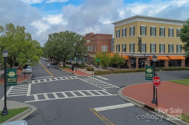 1855 Second Baxter Xing, Fort Mill, SC 29708 - view of asphalt road with street lighting, curbs, traffic signs, and sidewalks