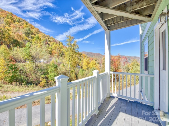 deck featuring a wooded view