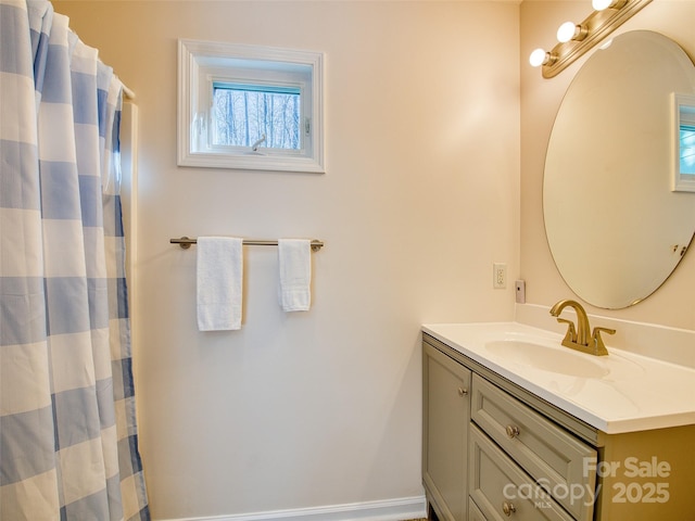 full bathroom with a shower with shower curtain and vanity