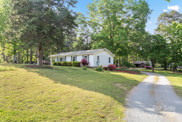 130 Casper Rd, Gold Hill, NC 28071 - manufactured / mobile home with a front yard and gravel driveway