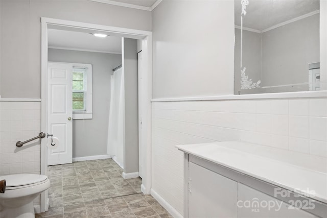 130 Casper Rd, Gold Hill, NC 28071 - bathroom with crown molding, tile walls, vanity, a wainscoted wall, and toilet