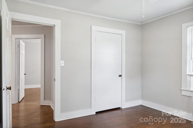 130 Casper Rd, Gold Hill, NC 28071 - unfurnished bedroom with baseboards, ornamental molding, and dark wood finished floors