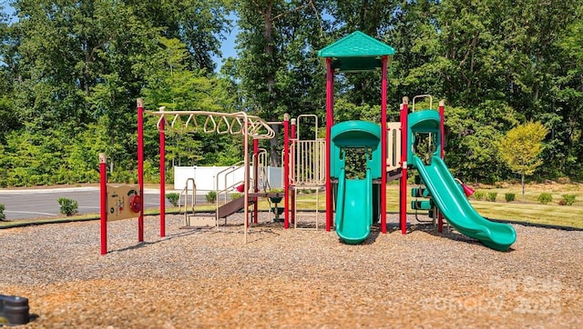 community jungle gym with view of scattered trees