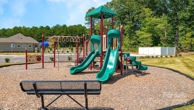 communal playground featuring fence