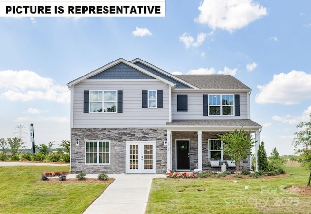 craftsman-style home with french doors, a front yard, and stone siding