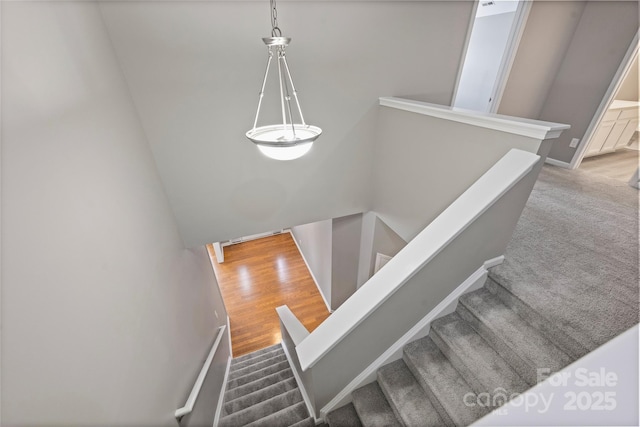 9321 Bradstreet Commons Way, Charlotte, NC 28215 - stairs featuring wood finished floors and baseboards