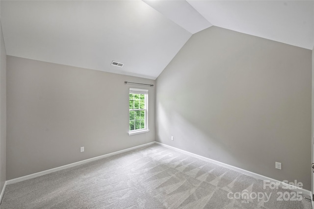 9321 Bradstreet Commons Way, Charlotte, NC 28215 - carpeted empty room with lofted ceiling and baseboards