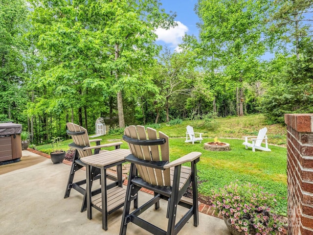 view of patio / terrace with a fire pit