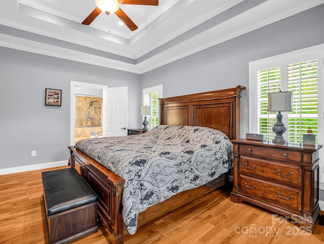 bedroom featuring ornamental molding, light wood finished floors, and multiple windows