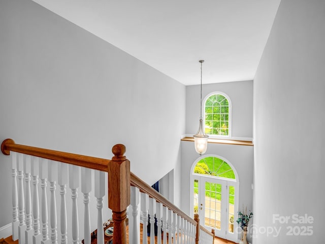staircase with a high ceiling