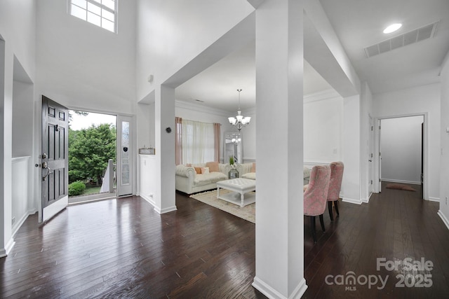 9029 Woodview Ct, Fort Mill, SC 29707 - foyer entrance featuring dark wood-type flooring, a chandelier, plenty of natural light, and baseboards