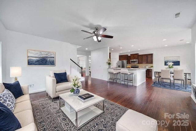 9029 Woodview Ct, Fort Mill, SC 29707 - living area featuring dark wood-style floors, a ceiling fan, recessed lighting, baseboards, and stairs
