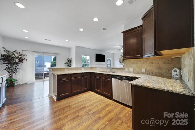 9029 Woodview Ct, Fort Mill, SC 29707 - kitchen with a sink, stainless steel dishwasher, light wood-style flooring, dark brown cabinetry, and recessed lighting