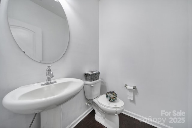 9029 Woodview Ct, Fort Mill, SC 29707 - bathroom with baseboards, toilet, wood finished floors, and a sink