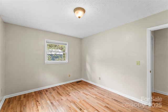 6562 Gingercake Rd, Newland, NC 28657 - spare room featuring light wood finished floors and baseboards