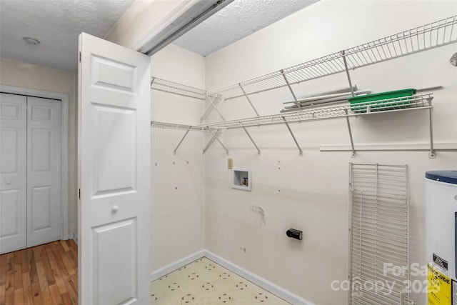6562 Gingercake Rd, Newland, NC 28657 - laundry room with washer hookup, electric water heater, and baseboards