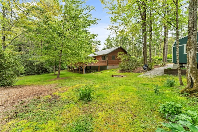 6562 Gingercake Rd, Newland, NC 28657 - view of green lawn featuring a wooden deck