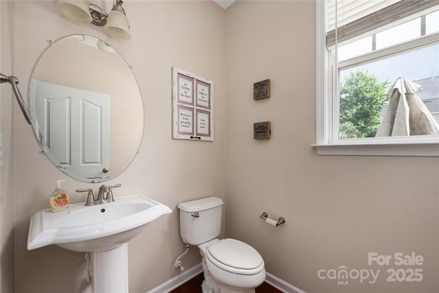 9159 Marasol Ln, Concord, NC 28027 - bathroom with baseboards, toilet, and a sink