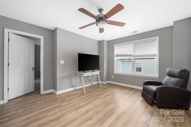 9159 Marasol Ln, Concord, NC 28027 - living area with light wood finished floors, baseboards, and ceiling fan