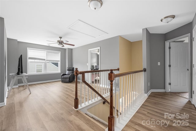 9159 Marasol Ln, Concord, NC 28027 - stairs featuring attic access, wood finished floors, ceiling fan, and baseboards
