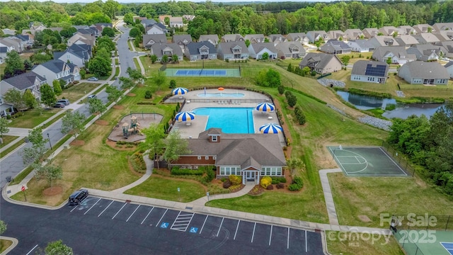 9159 Marasol Ln, Concord, NC 28027 - aerial overview of property's location with a pool, nearby suburban area, and a nearby body of water