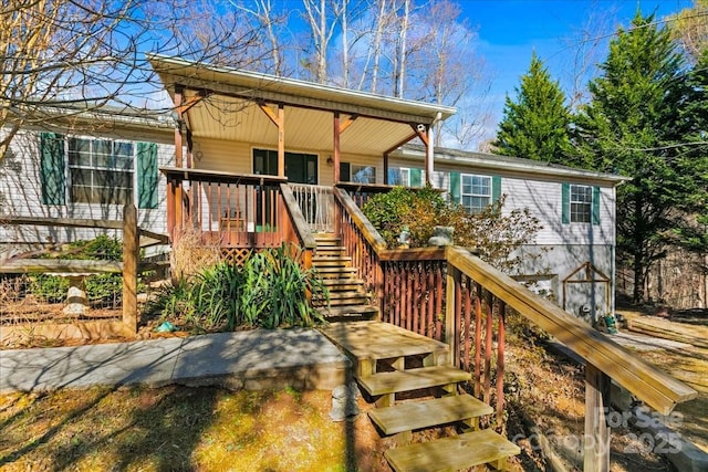back of property with stairs