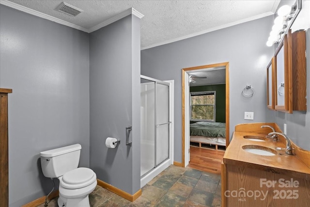 ensuite bathroom with baseboards, a stall shower, visible vents, and toilet