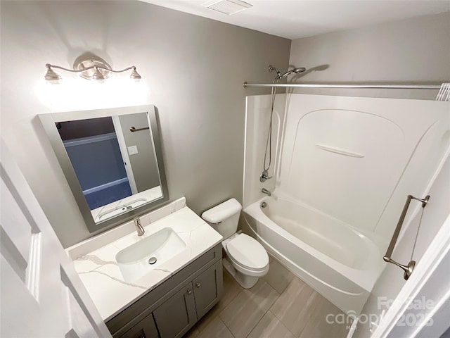 bathroom featuring vanity, shower / tub combination, and toilet