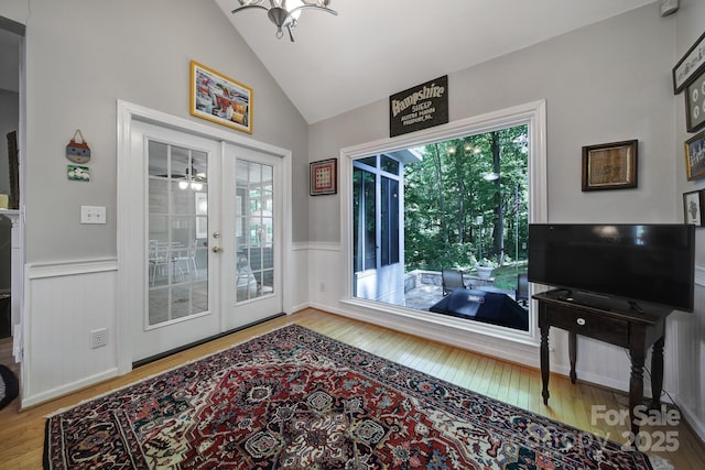 160 Fernbrook Dr, Mooresville, NC 28117 - doorway to outside with french doors, hardwood / wood-style floors, a wainscoted wall, and high vaulted ceiling