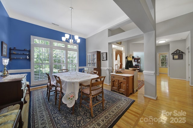160 Fernbrook Dr, Mooresville, NC 28117 - dining room featuring a chandelier and light wood-style floors