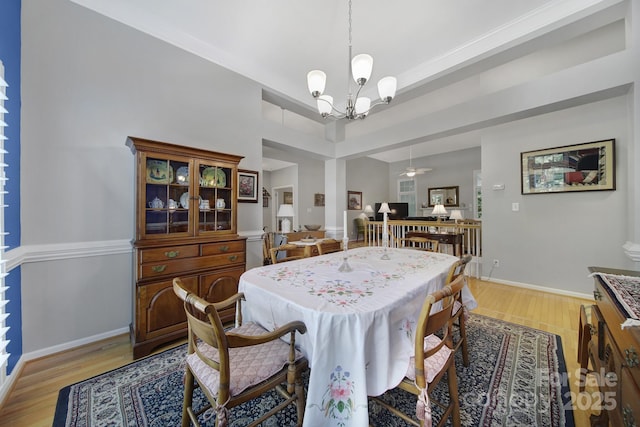 160 Fernbrook Dr, Mooresville, NC 28117 - dining area with a chandelier, light wood-type flooring, and a ceiling fan