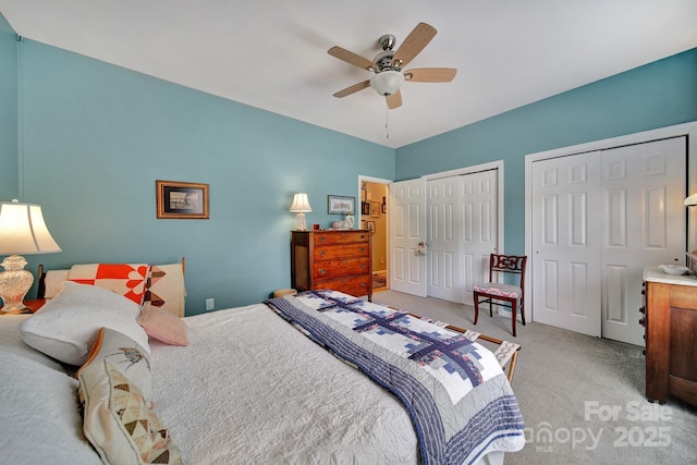 160 Fernbrook Dr, Mooresville, NC 28117 - bedroom with multiple closets, light carpet, and ceiling fan