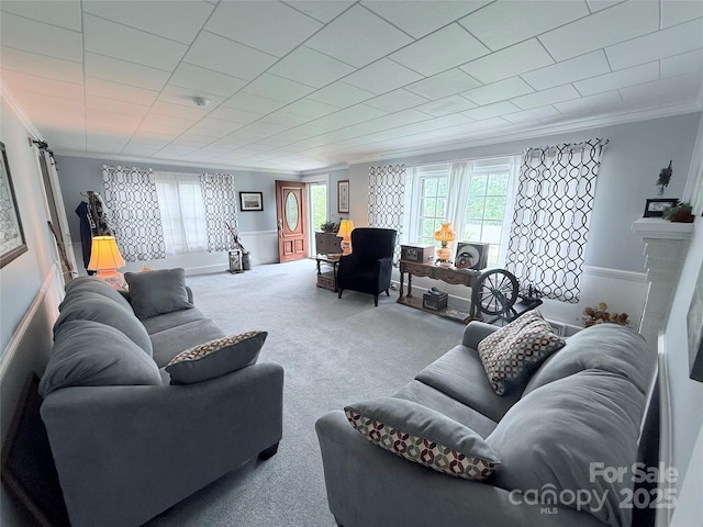 living room with ornamental molding and carpet flooring