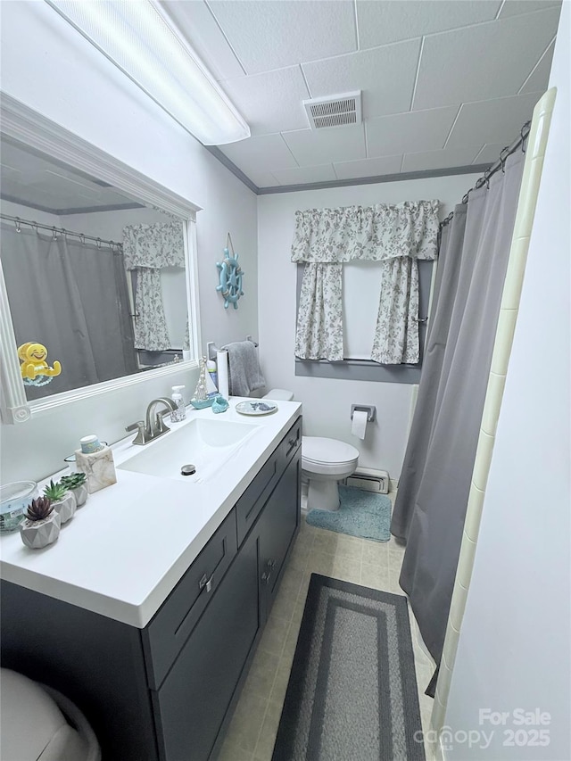 full bathroom featuring toilet, tile patterned floors, a baseboard heating unit, vanity, and curtained shower