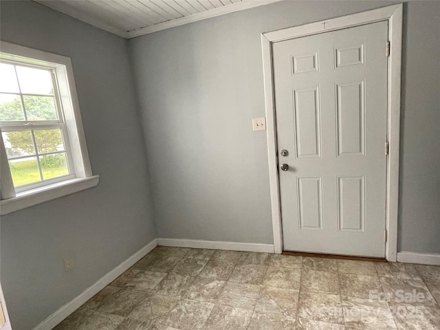 empty room featuring baseboards