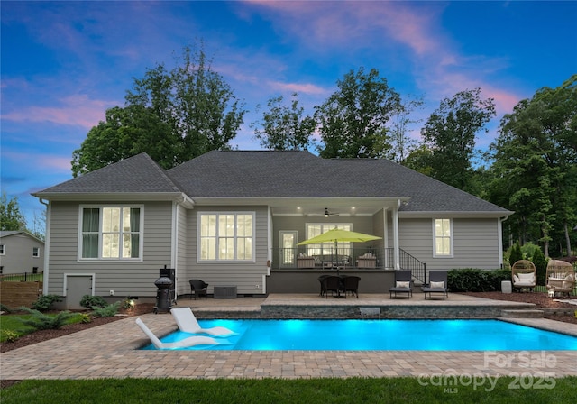 2646 Lee Lawing Rd, Lincolnton, NC 28092 - back of property with a patio area, ceiling fan, an outdoor pool, and a shingled roof
